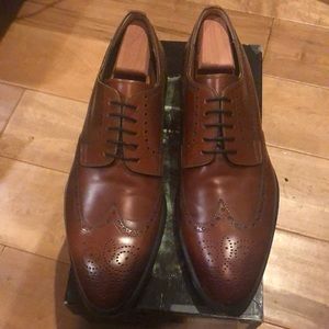 New and never worn Brown Magnanni size 12 wingtip men’s shoes.